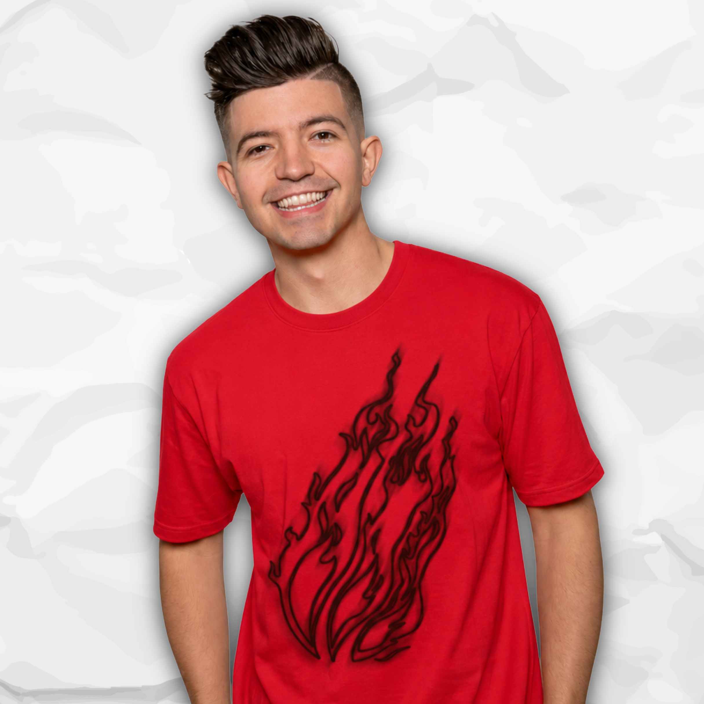 PrestonPlayz with styled dark hair wearing a bright red crewneck t-shirt with a black flame graphic on the front, set against a light gray crumpled paper background.