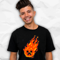 Preston Plauz with styled dark hair wearing a black t-shirt with a pixelated orange and yellow flaming face graphic, set against a light gray crumpled paper background.