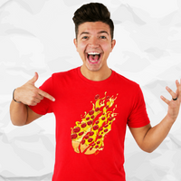 Preston Playz wearing a bright red t-shirt with a graphic of a slice of pizza exploding in flames, pointing to the shirt against a crumpled white paper background.